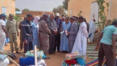صورة توزيع مواد غذائية وخيم على متضررين من الأمطار في بوكي